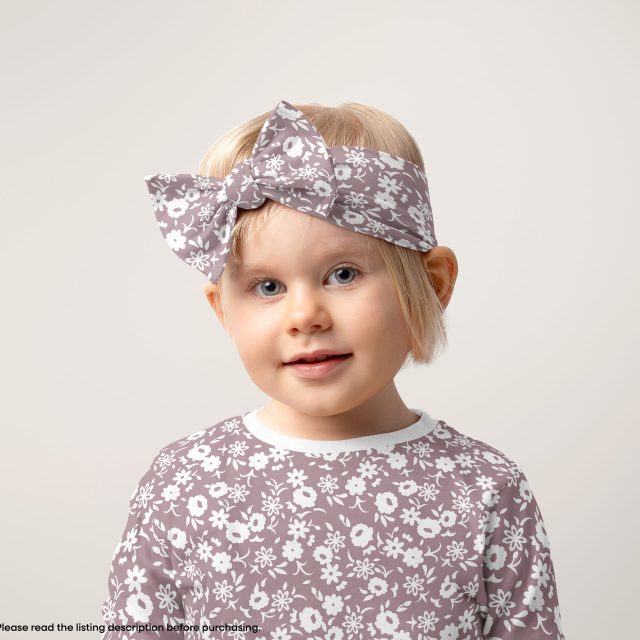 little girl with headband and floral pattern